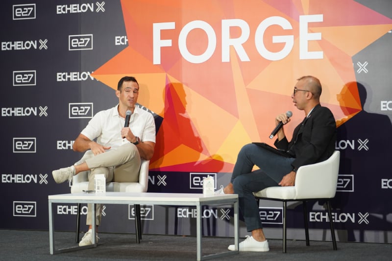 Two speakers in conversation on an Echelon main stage